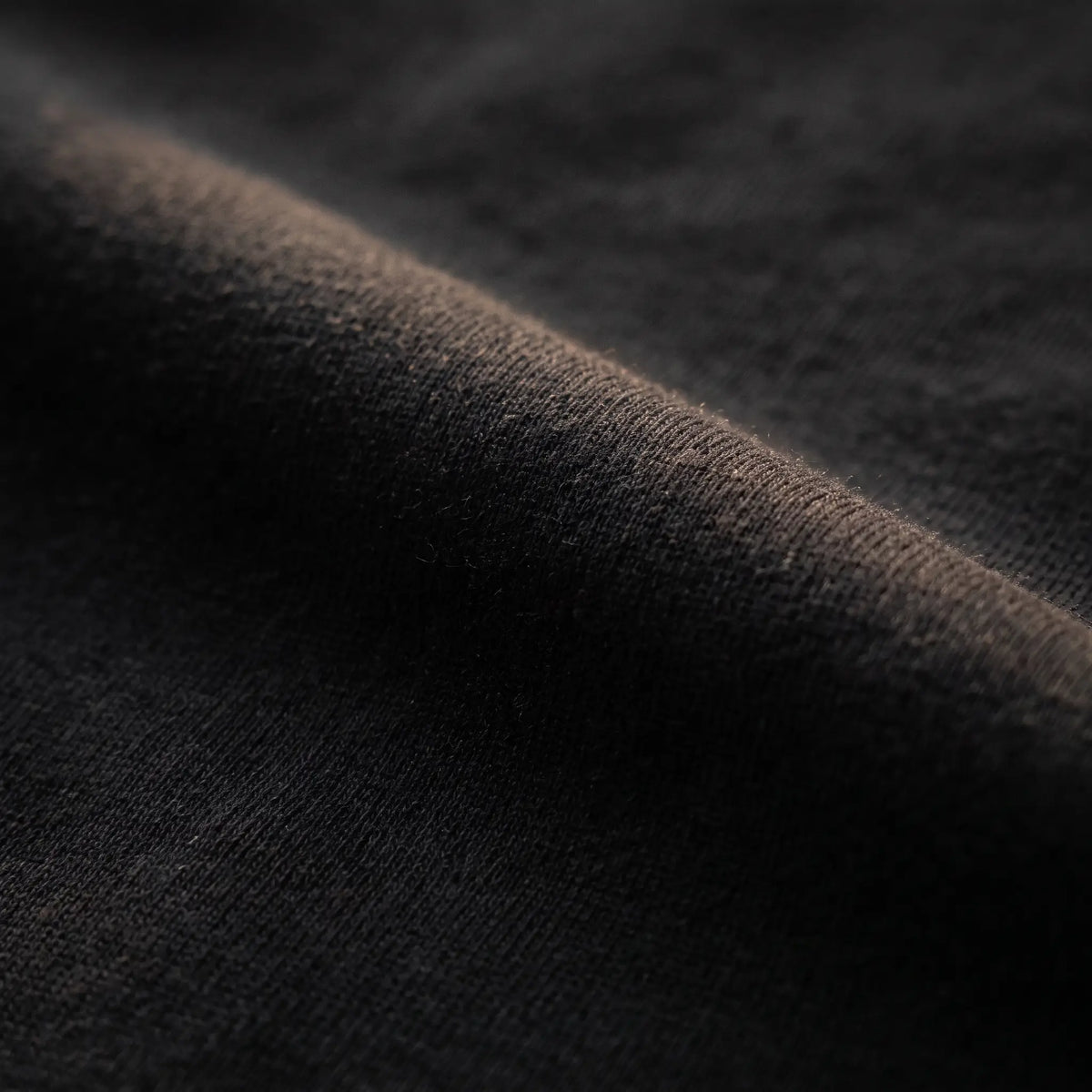 Feed the Hunger black heavyweight fabric detail