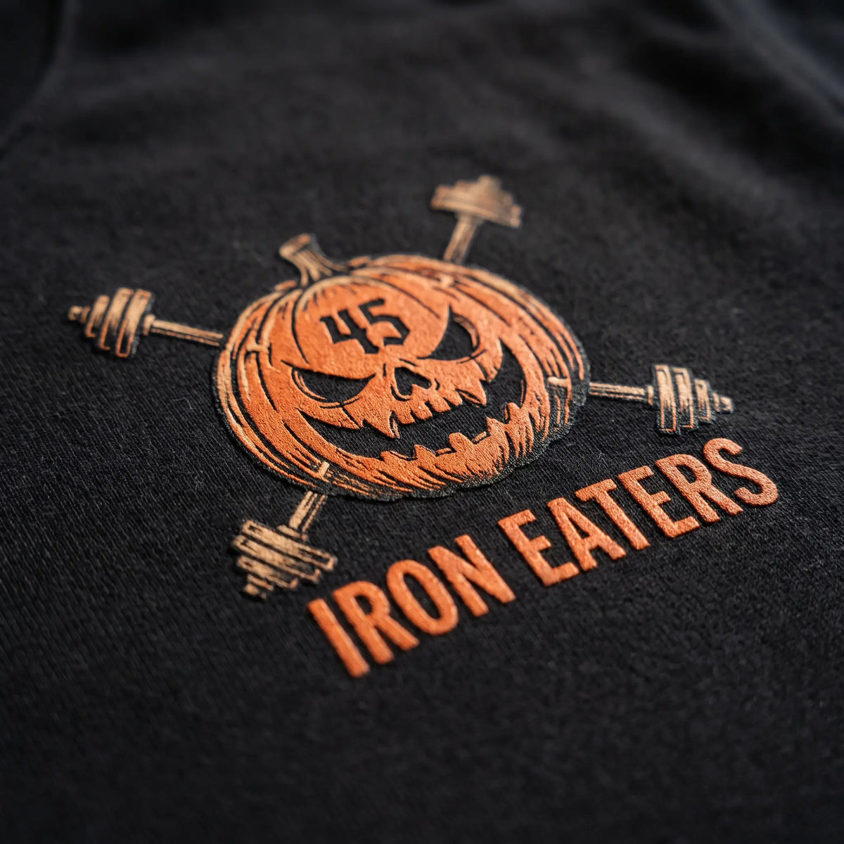 Iron Eaters Feed the Hunger pumpkin logo detail