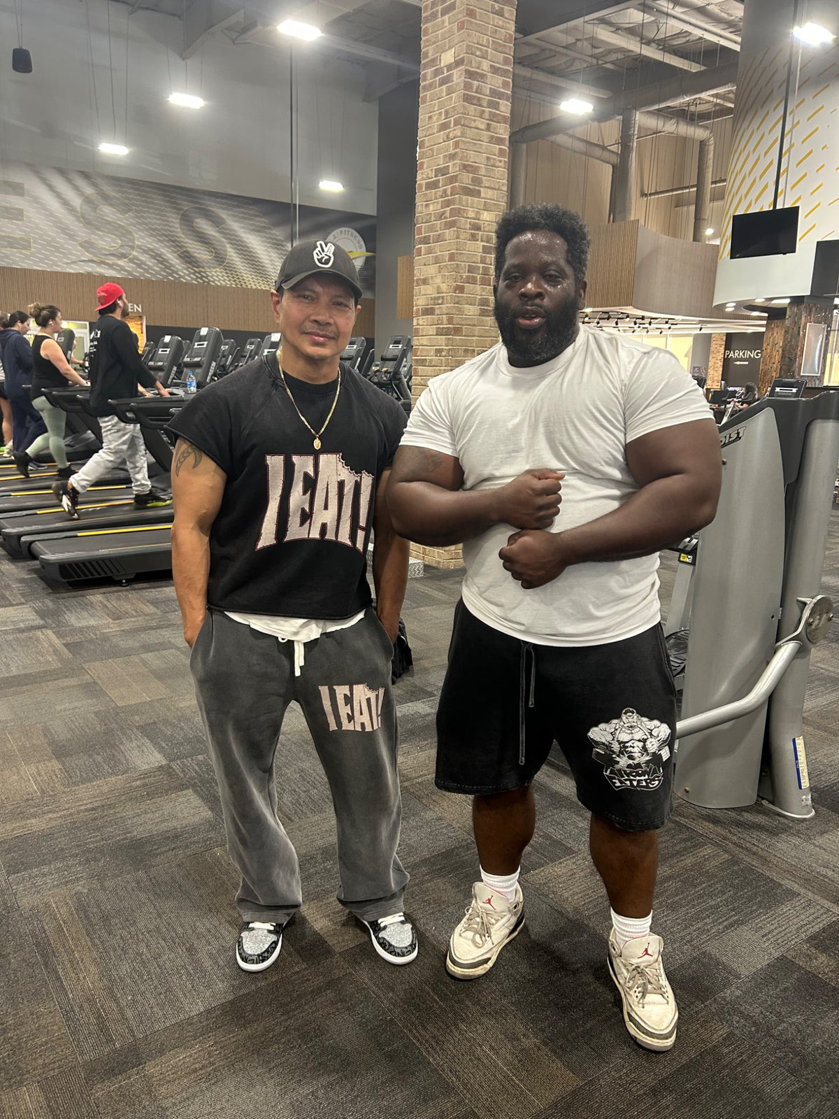 Iron Eaters Association members in the gym wearing I EAT apparel